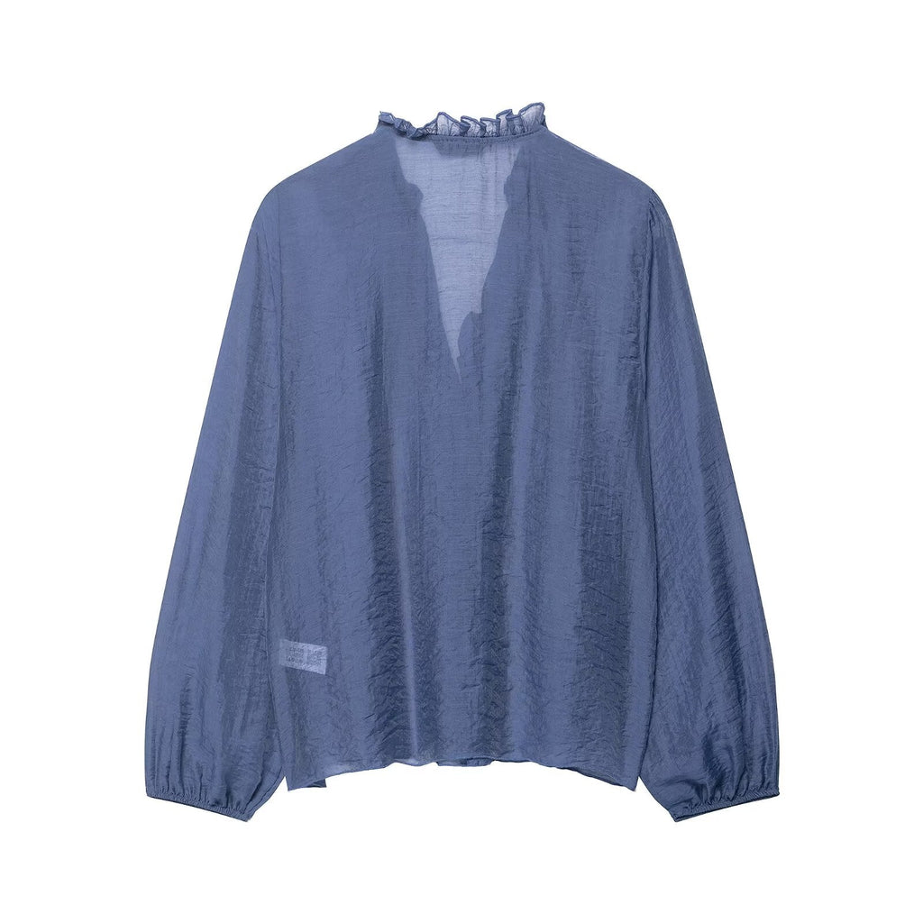 Women’s long sleeve laminated autumn shirt with decorative details, stylish women’s clothing from Wanita Store.