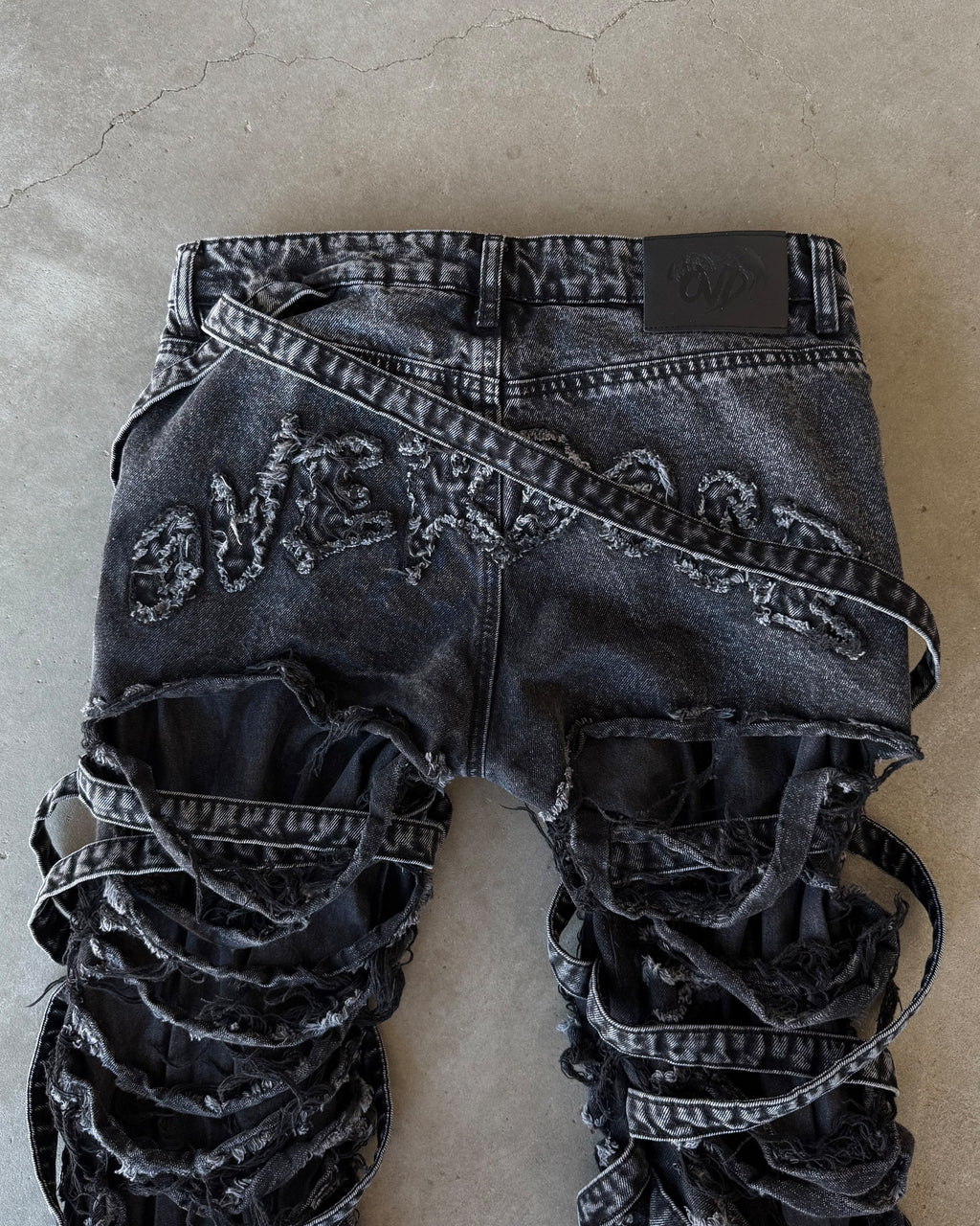 Venim 2.0 Onyx bottoms by whathappenedtogod, black casual pants with a relaxed fit, displayed on a model.