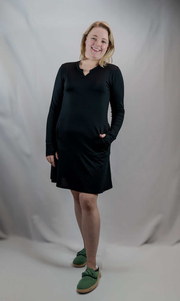 Black EverReady pocket dress by Transcendent Active, featuring a comfortable fit and functional pockets, perfect for casual wear.