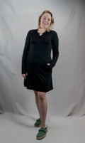 Black EverReady pocket dress by Transcendent Active, featuring a comfortable fit and functional pockets, perfect for casual wear.