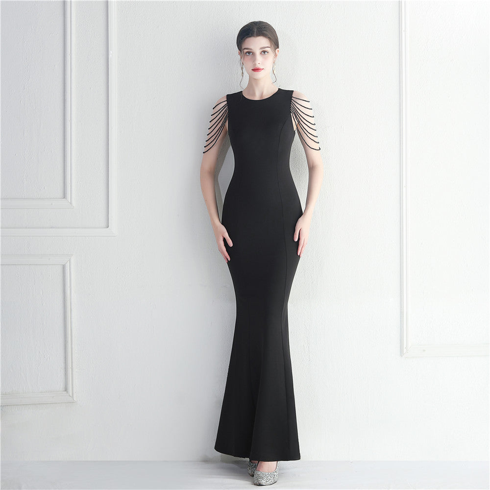 Beaded bridesmaid guest wedding dress with long fish tail silhouette and intricate beadwork by Wanita Store.