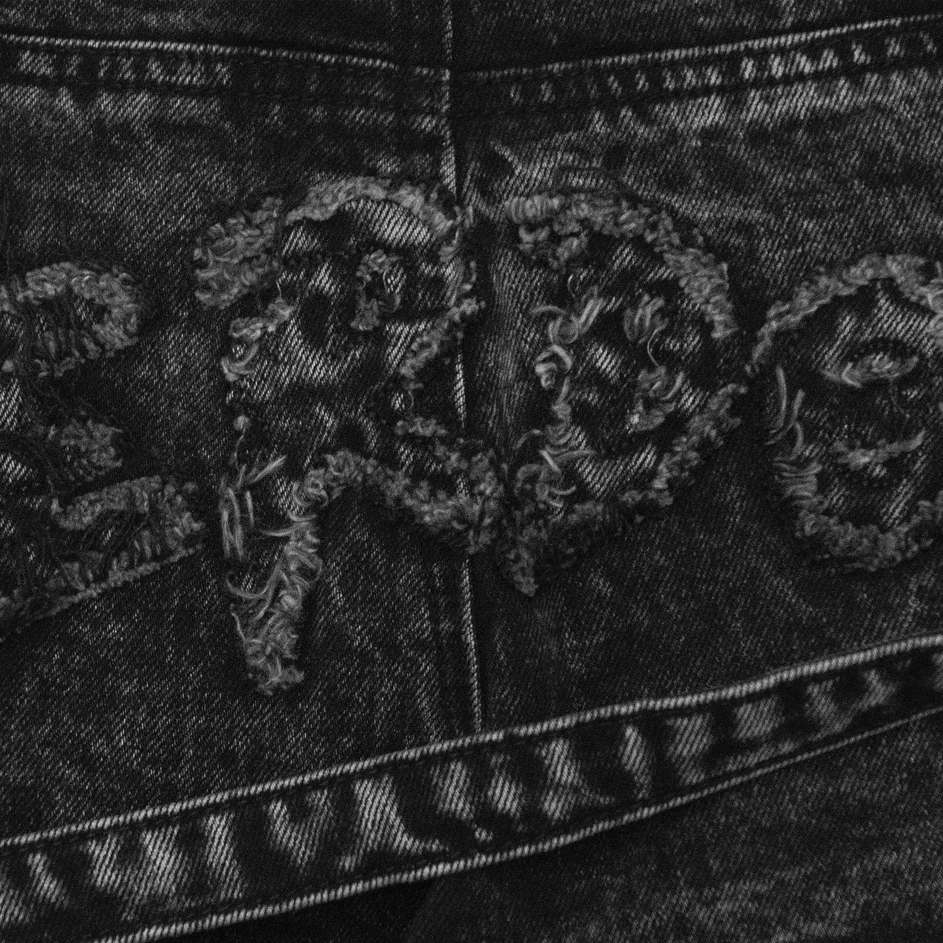 Venim 2.0 Onyx bottoms by whathappenedtogod, shown from the back with a close-up view of the design and fabric texture.