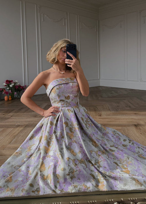 JessaKae Anastelle strapless jacquard dress with intricate pattern, fitted bodice, and flowing skirt, perfect for formal occasions.