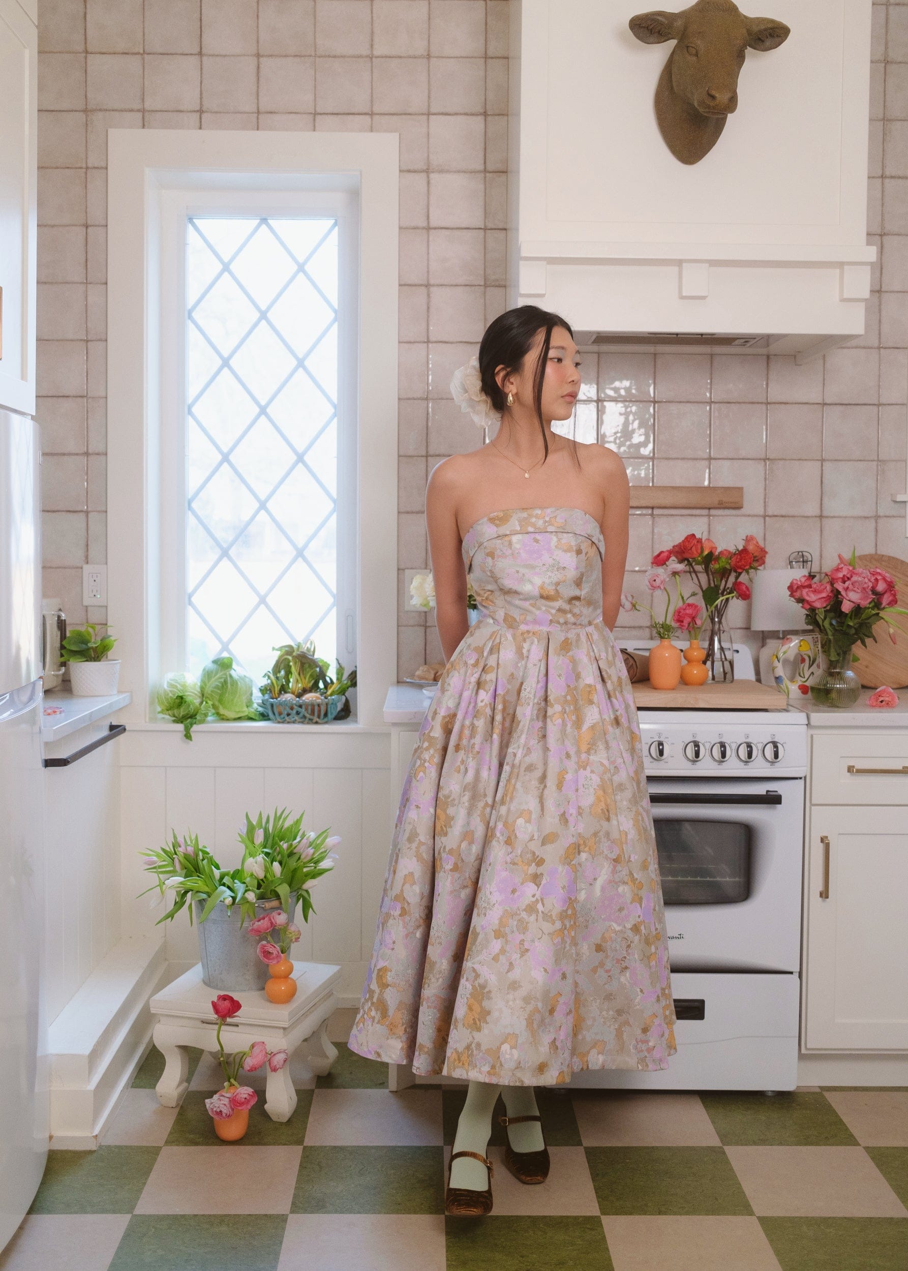JessaKae Anastelle strapless Jacquard dress with intricate pattern, fitted bodice, and flowing skirt, suitable for formal occasions.