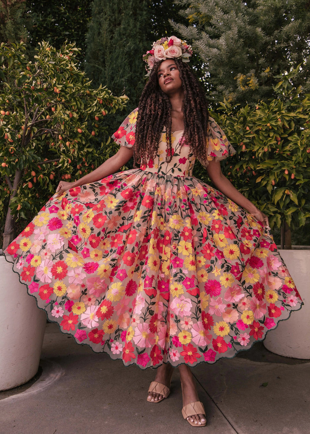 JessaKae English Garden Dress with floral pattern, sleeveless design, and flowing fabric perfect for spring and summer wear.