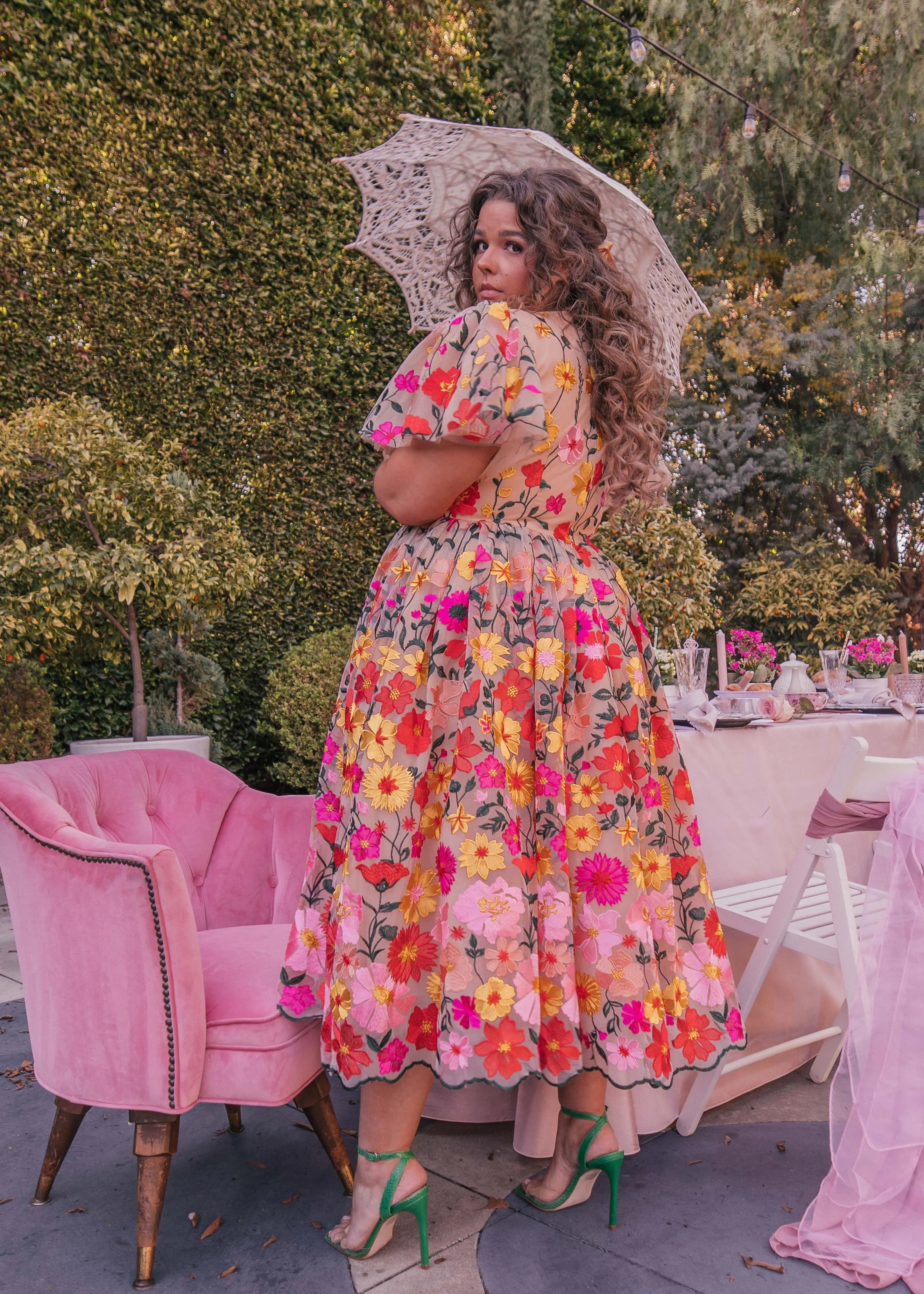 JessaKae English Garden Dress displayed on a hanger with floral pattern and flowing fabric, perfect for spring or summer wear.