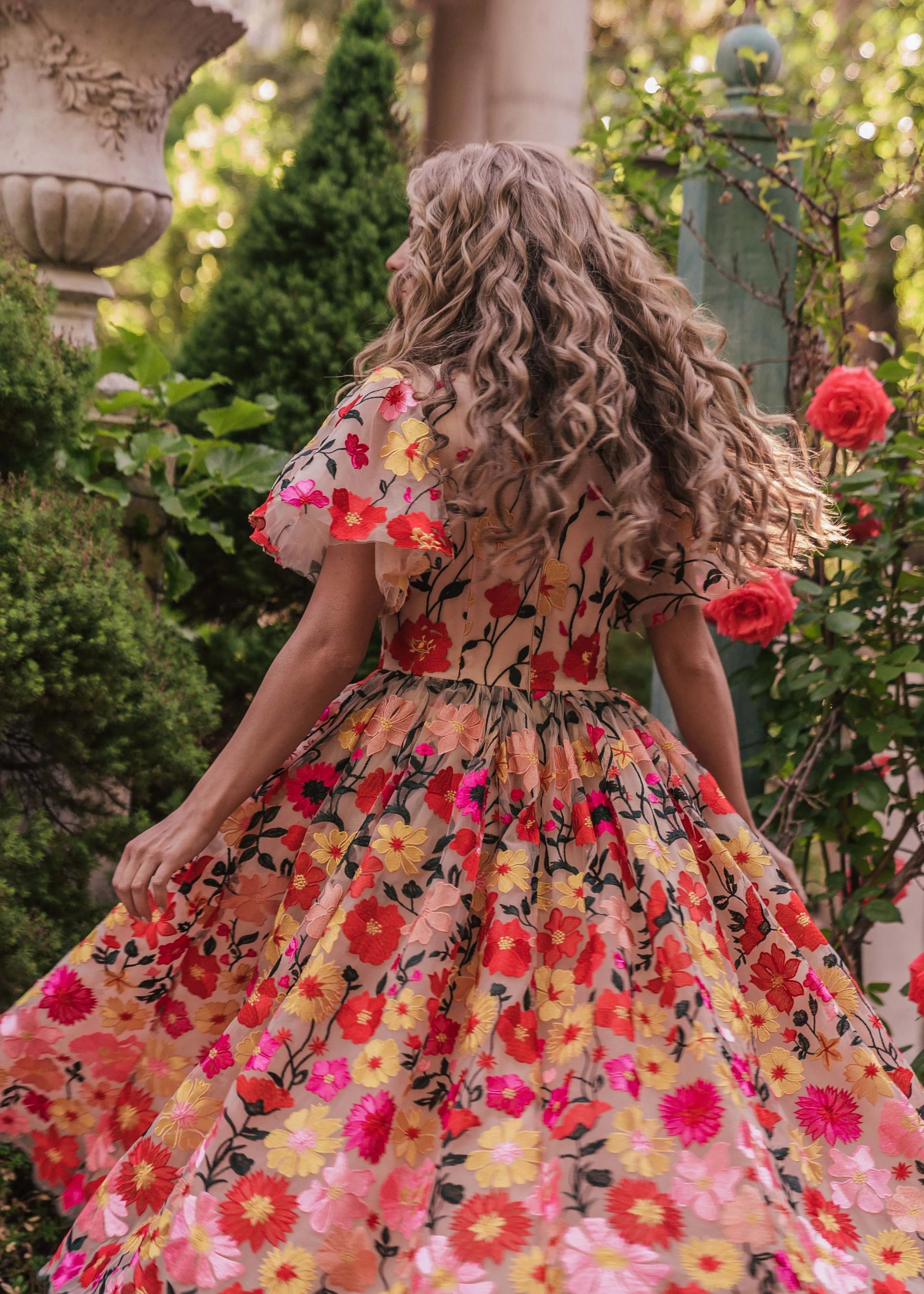 JessaKae English Garden Dress displayed on a hanger, featuring floral pattern, lightweight fabric, and feminine design.