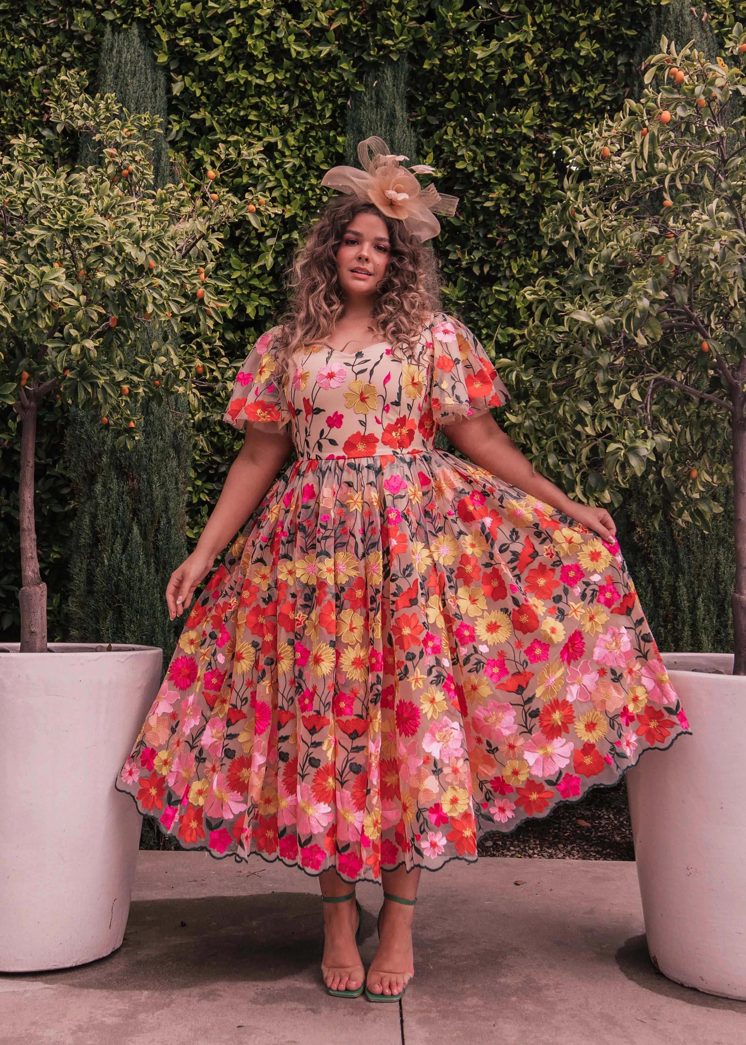 Pink and multi-colored English Garden Dress by JessaKae, featuring floral patterns and a flowy, feminine silhouette.