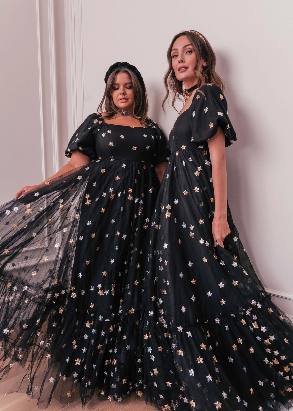 Black Wendy Dress by JessaKae featuring star patterns, sleeveless design, and flowy fabric for a stylish look.