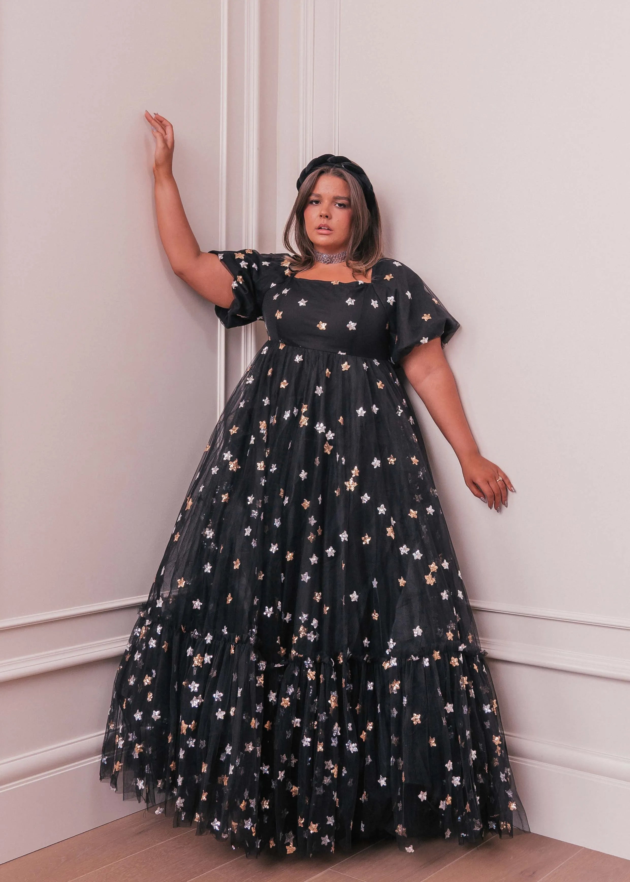 Black Wendy Dress by JessaKae featuring star patterns, fitted bodice, and flowing skirt for stylish everyday wear.
