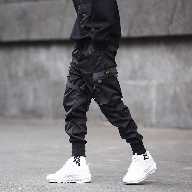 Niepce YE2032 matte black joggers, stylish sweatpants with a relaxed fit and elastic waistband, displayed on a hanger.
